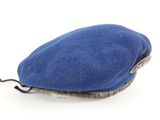 a blue beret hat on a white background