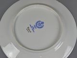 a white plate with a blue design on it