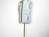 the mannequin is wearing a white vest and a red hat