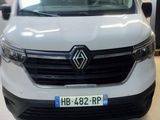 the front of a white van parked in a garage