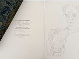 a book with a drawing of a man holding a dog