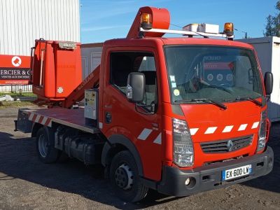 a red truck that is parked in front of a building