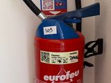 a fire extinguisor attached to a wall
