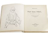 an open book with a drawing of a man sitting on a chair
