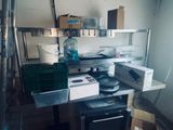 a kitchen with a lot of boxes on the counter