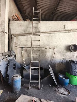 a ladder that is leaning against a wall in a garage