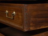 a close up of a drawer with a clock on top of it