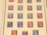 framed picture of a collection of stamps with a picture of queen elizabeth