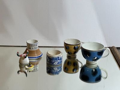 a glass table with cups and saucers on it