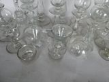 a lot of empty wine glasses sitting on a table
