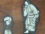 a painting of a man and a woman on a table