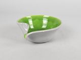 green and white ceramic bowl with a curved edge