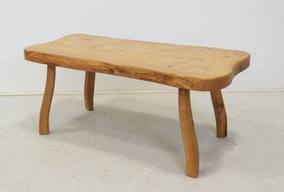 a small wooden bench that is sitting on the floor