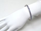 a bracelet that is on a mannequin ' s hand