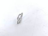 a diamond ring sitting on top of a white plate