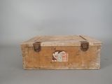 a wooden box with a hole in it on a table