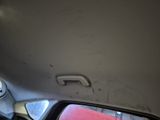a view of the inside of a car from the passenger seat