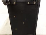 a piece of luggage sitting on top of a cardboard box
