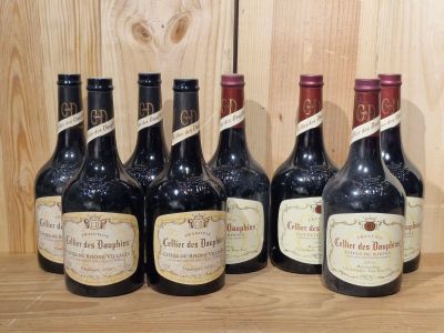 six bottles of wine are lined up on a wooden shelf