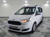 the white van is parked on a checkered floor in the garage
