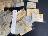 a pile of old envelopes sitting on top of a table