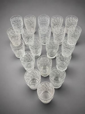 a group of glasses sitting on top of a table next to each other