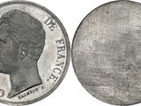 an image of a silver coin with a woman ' s face on it