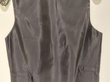 the back of a gray jacket hanging on a hanger