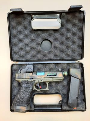 the gun is in the case on the table ready to be used