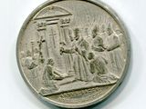 une pièce de monnaie en argent portant l'image d'un homme et d'une femme