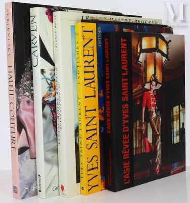 a lot of books that are sitting on a table