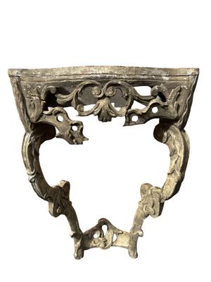 a metal shelf that has a heart shaped design on it