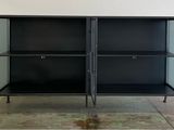 an image of a black metal cabinet in a room