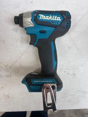 a close up of a cordless drill on a table