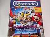 nintendo magazine with a picture of mario and luigi on the cover