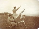 an old photo of a man and a woman looking at a telescope