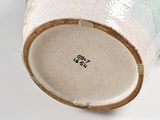 a close up view of a vase on a table
