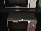 a microwave and a microwave oven on a black table