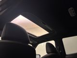 a view of the sunroof from inside of a car