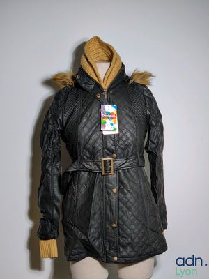 the jacket is black and has a fur collar on it