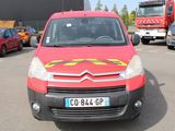 a red van with a yellow star on the front parked in a parking lot