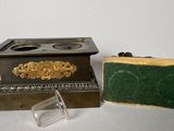 a small box and a soap dish sitting on a table