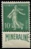 a green stamp with a picture of a man on it