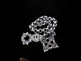 a silver chain with a cross and a cross on it