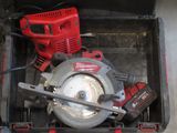 a red and black tool box with a circular saw and a red and black tool