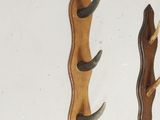 several pieces of wood and antelope mounted on a wall