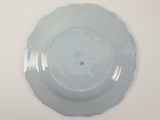 a blue plate with a blue flower on it