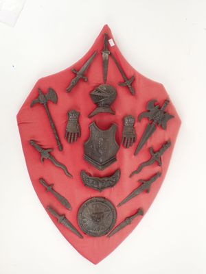 a picture of a red shield with various items on it