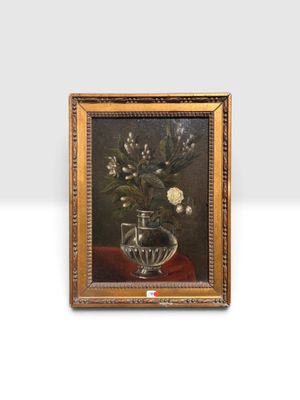 une peinture de fleurs dans un vase en verre sur une table