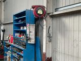 an image of a garage with a blue work bench